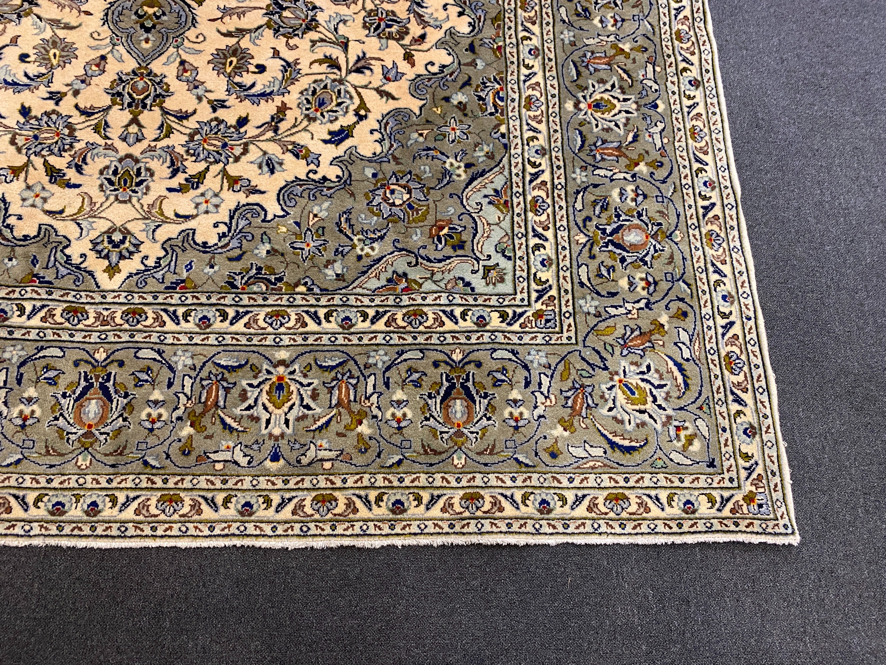 A Kashan ivory ground carpet, 355cm x 246cm